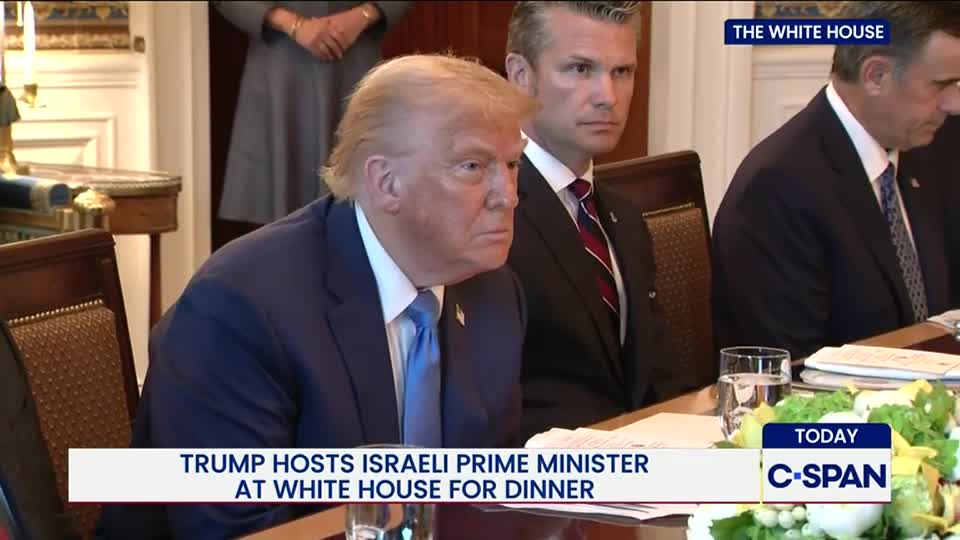 Donald Trump, in a blue suit and tie, sits at a table, looking toward the left. A C-SPAN graphic at the bottom announces the White House dinner with the Israeli Prime Minister.

