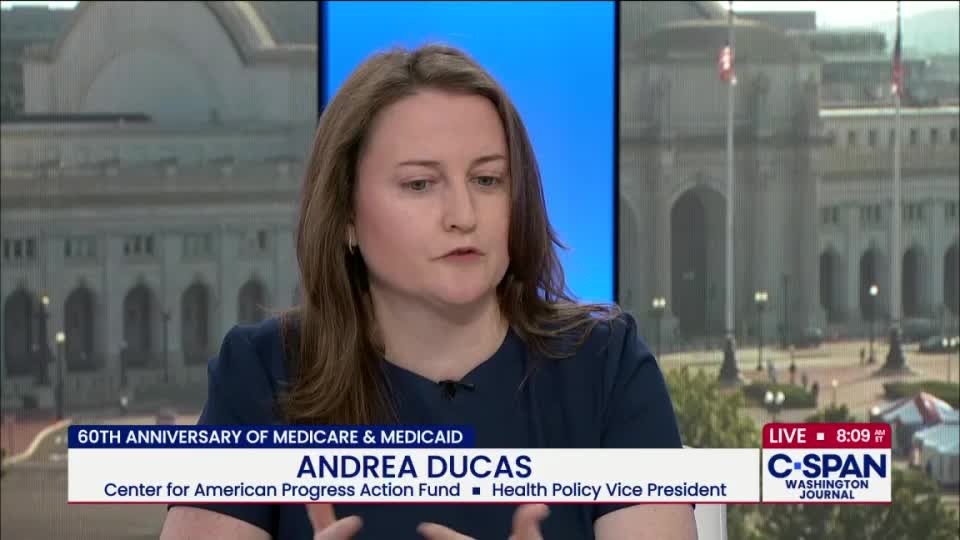 Andrea Ducas gestures with her hands as she speaks, framed by a C-SPAN graphic about Medicare and Medicaid. Outside the window behind her, I can see a building in Washington, D.C.
