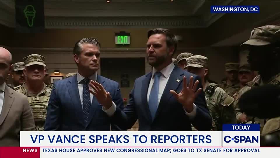 Two men in suits stand before a crowd of soldiers, gesturing with their hands. A C-SPAN graphic at the bottom identifies the scene as VP Vance speaking to reporters in Washington, D.C.
