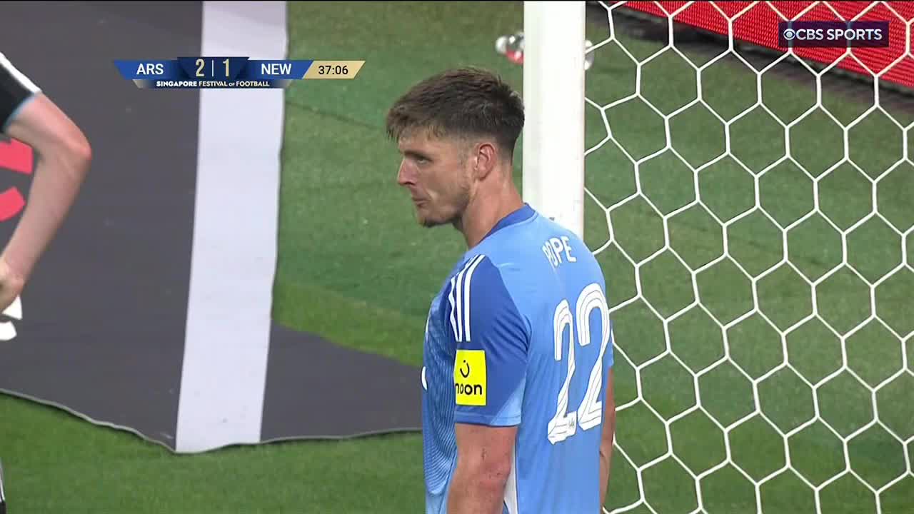 On the CBS Sports Network USA broadcast, the Newcastle United goalkeeper, wearing number 22, stands near the net, his gaze fixed on something out of frame. The scoreboard shows a 2-1 score with 37:06 on the clock.
