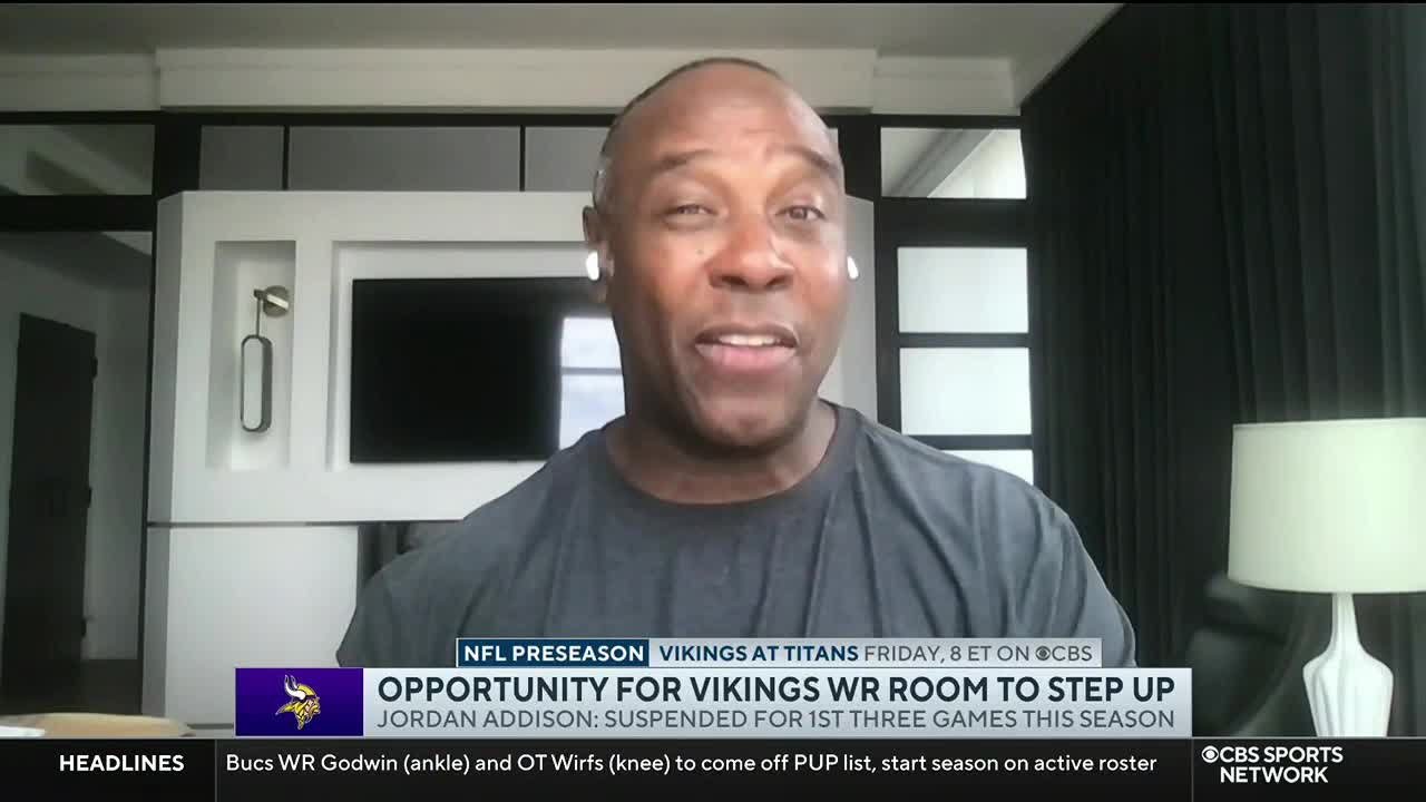 A man wearing earbuds is speaking on CBS Sports Network USA, framed against a modern interior. A graphic beneath him discusses the Vikings' wide receiver situation.
