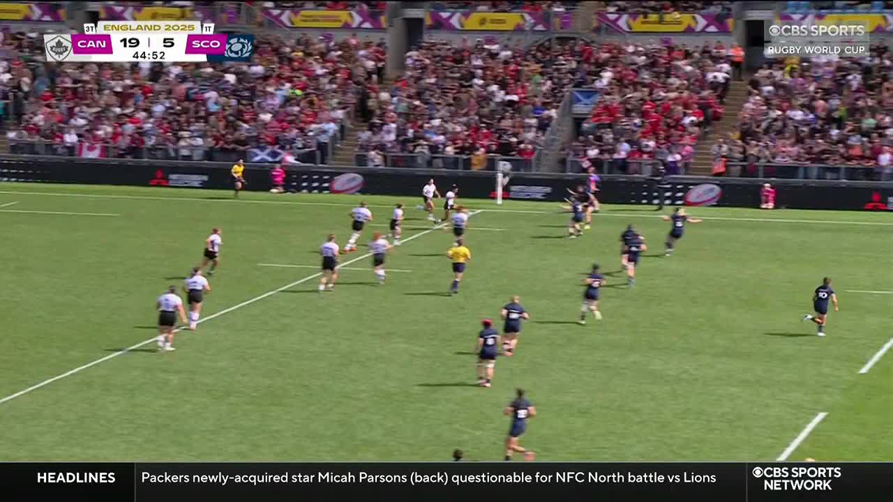 Players in white and black jerseys sprint downfield, while a group in navy blue chase after them. The score, broadcast on CBS Sports Network USA, shows Canada leading Scotland in the Rugby World Cup.
