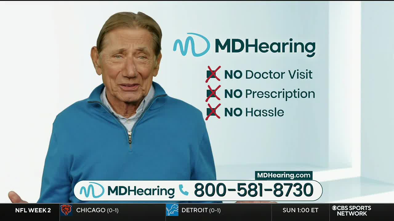 On CBS Sports Network USA, a man in a blue sweater is speaking directly to the camera, promoting MDHearing. Below, the game clock ticks toward Sunday at 1:00 ET.
