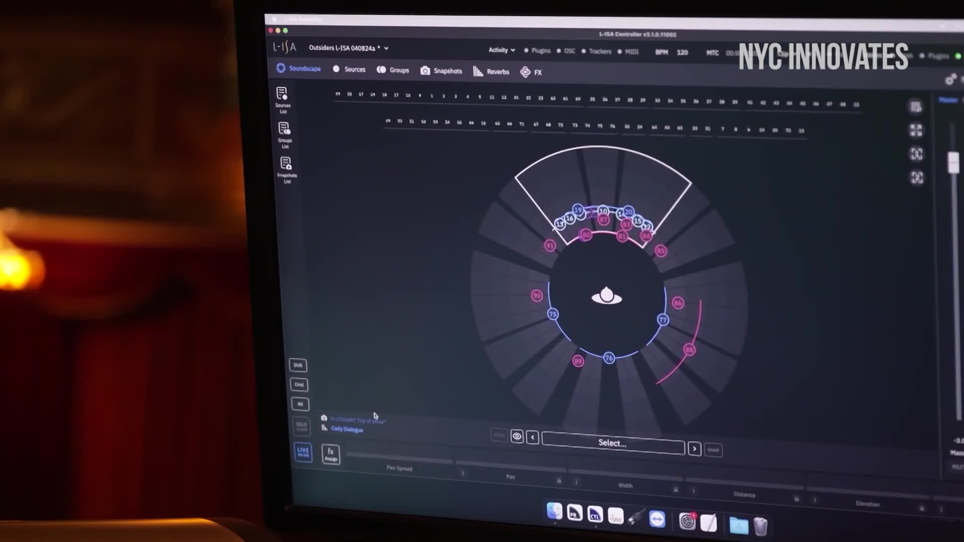 A computer screen displays a circular diagram with blue and pink nodes. The interface, labeled "NYC Innovates," appears to be a control panel for a live event.
