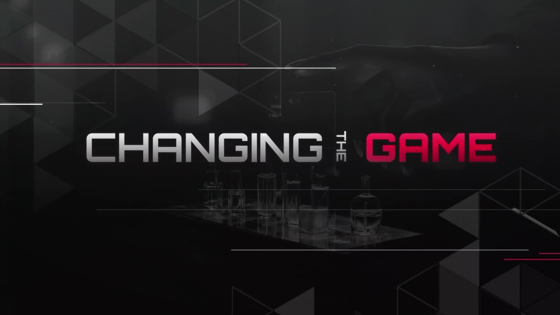 The title "CHANGING THE GAME" is displayed in silver and red against a dark background. Below the words, a line of laboratory glassware is visible.
