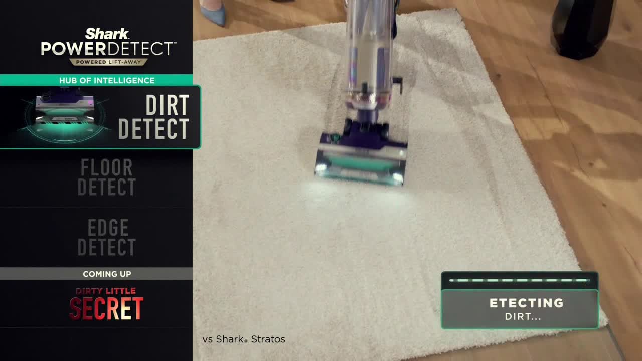 A vacuum cleaner glides over a white rug, its illuminated head moving smoothly. The screen displays "Detecting Dirt..." as the machine does its work.

