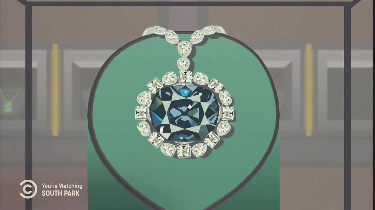 A large, blue gem necklace sits on a green display, sparkling in the light. The Comedy Central logo confirms this is a scene from *South Park* in the United States.
