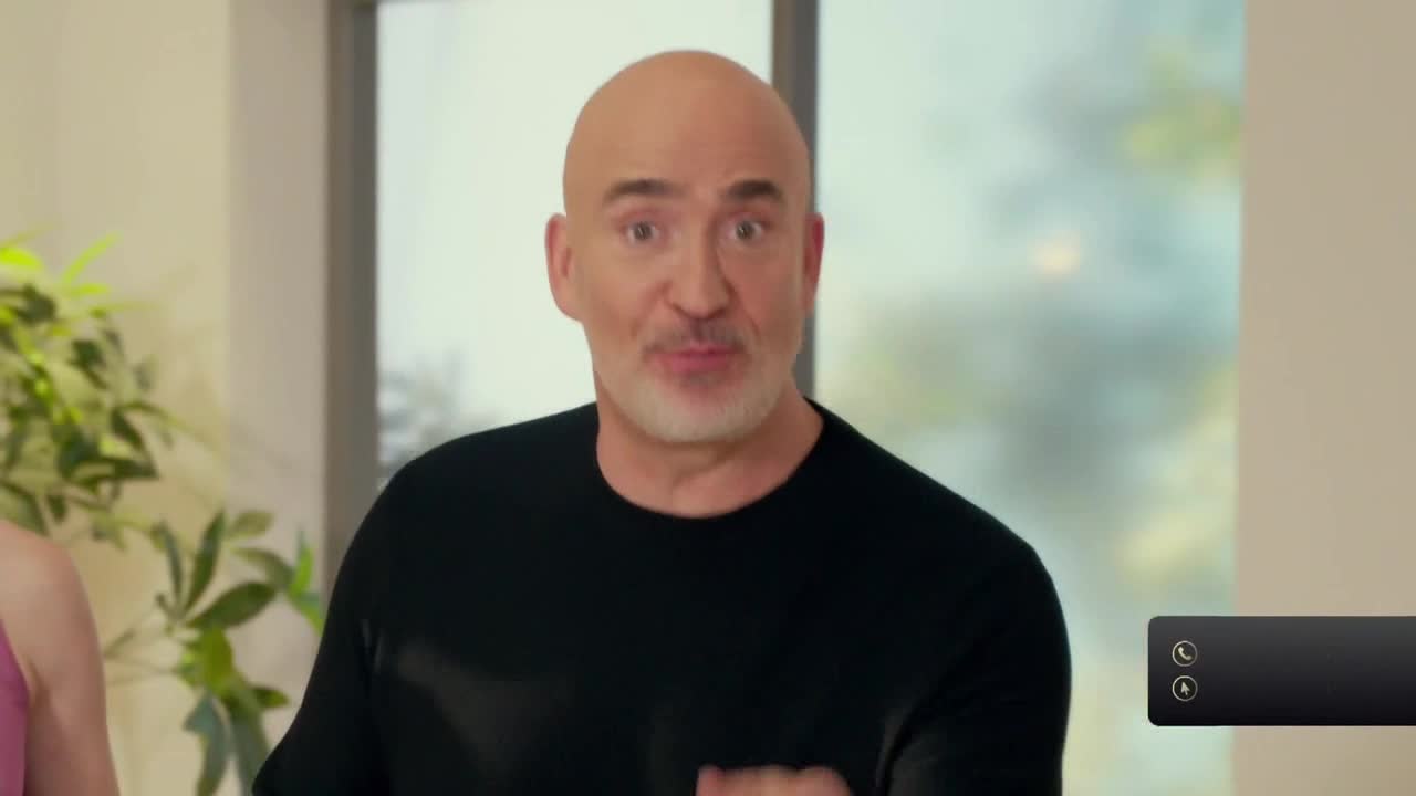 A bald man with a white beard is speaking, his expression animated. He's wearing a black shirt, and there's a Comedy Central logo in the corner.
