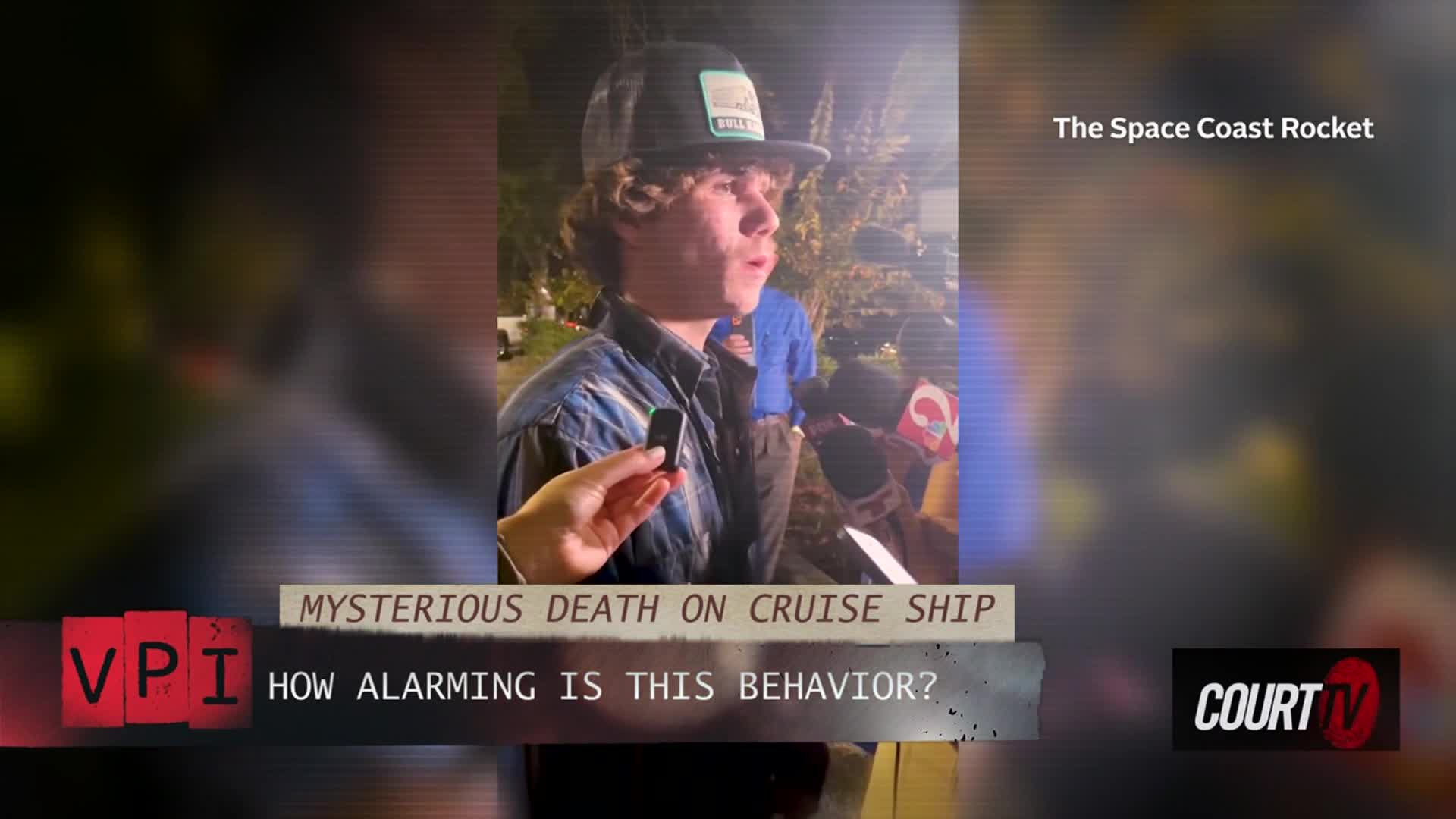 A young man in a baseball cap is speaking into a microphone, surrounded by other mics held by unseen people. The scene appears to be an interview, possibly for Court TV, with a graphic about a mysterious death on a cruise ship displayed at the bottom.
