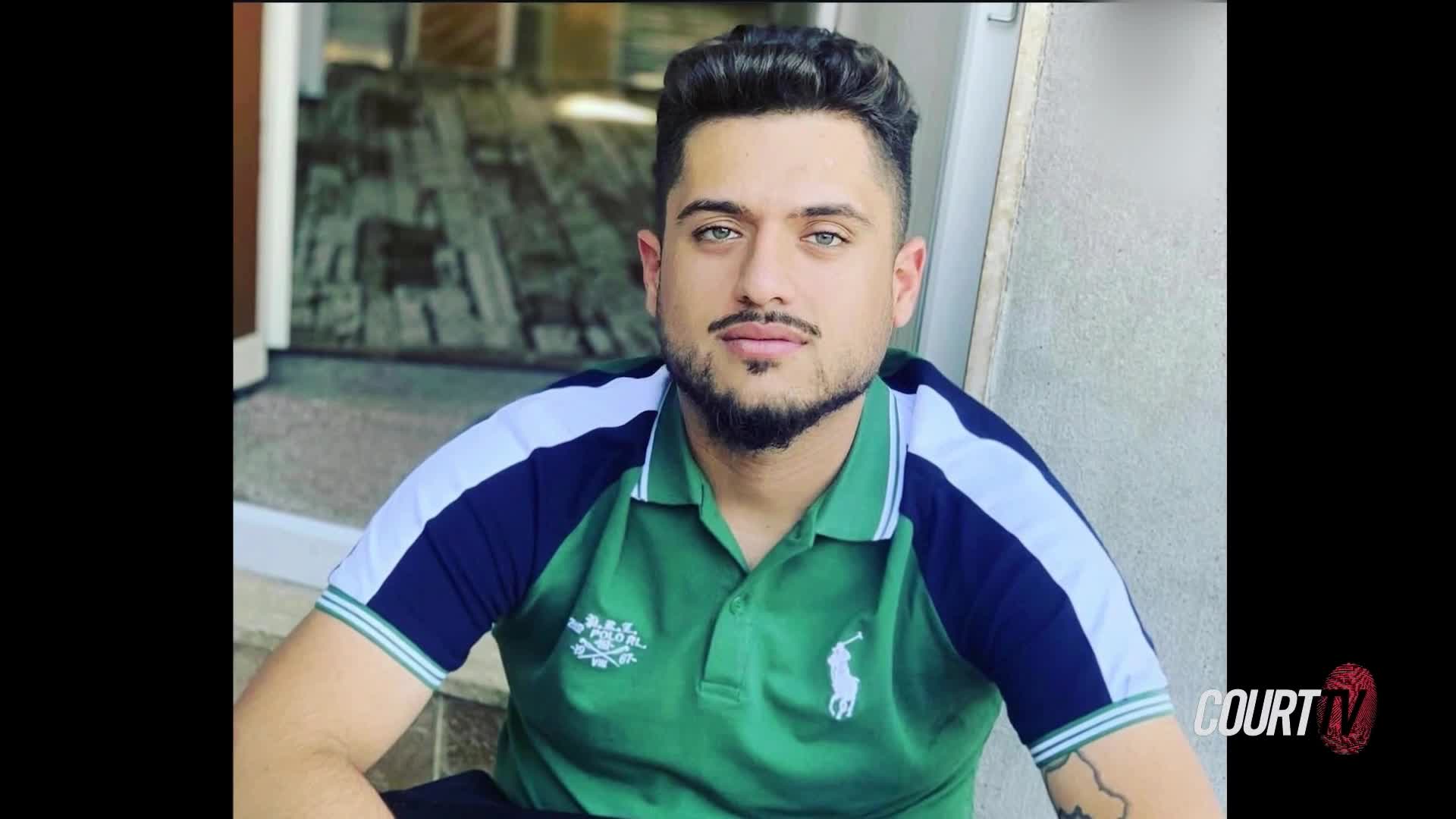 A man with dark hair and a trimmed beard sits on a step, looking directly at the camera. He's wearing a green polo shirt with dark blue trim, and the Court TV logo is visible in the corner.
