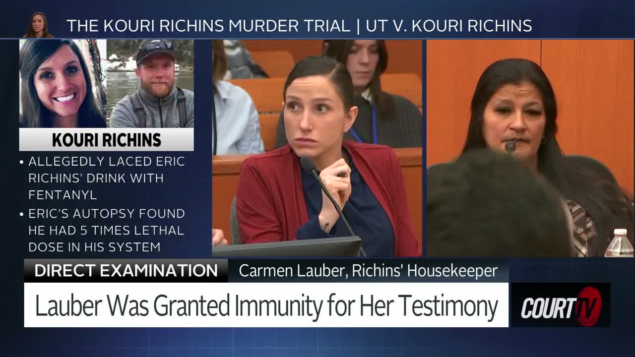 A woman in a red blazer leans forward, her hand resting on her chin as she listens intently. Beside her, another woman with long dark hair speaks into a microphone. The screen displays "THE KOURI RICHINS MURDER TRIAL | UT V. KOURI RICHINS."