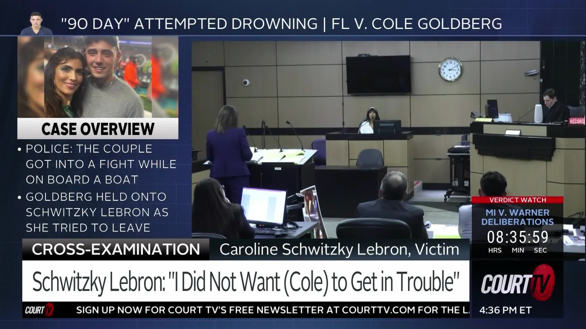 A woman in a purple suit stands at a podium, addressing the court. The judge sits behind a raised bench, and a jury box is visible to the right.