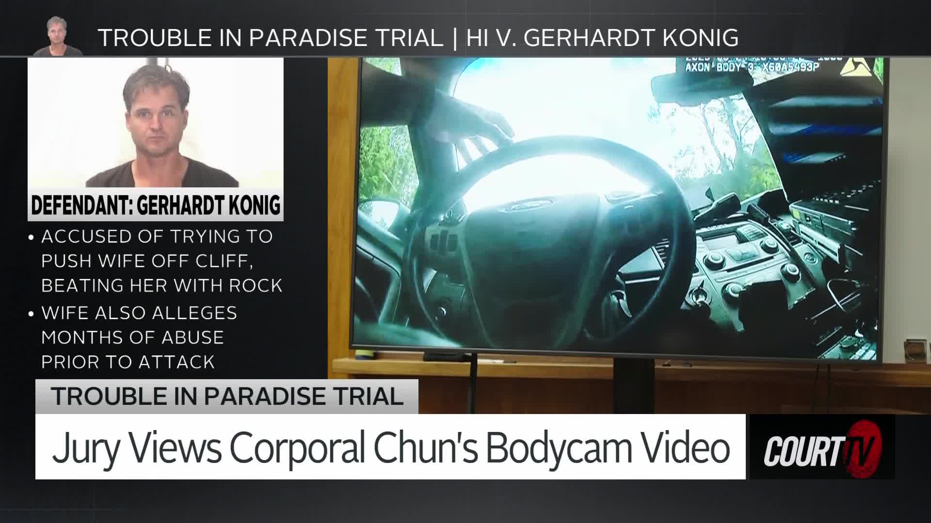 A police car's dashboard and steering wheel fill the screen as the camera pans. The jury is watching bodycam footage from Corporal Chun's perspective.