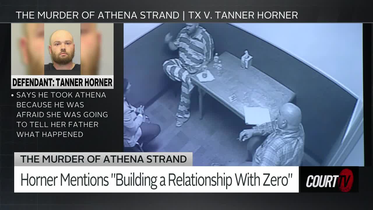 A man in a striped jumpsuit sits across a table from another man, gesturing with his hand. The courtroom camera captures this tense moment in Texas.