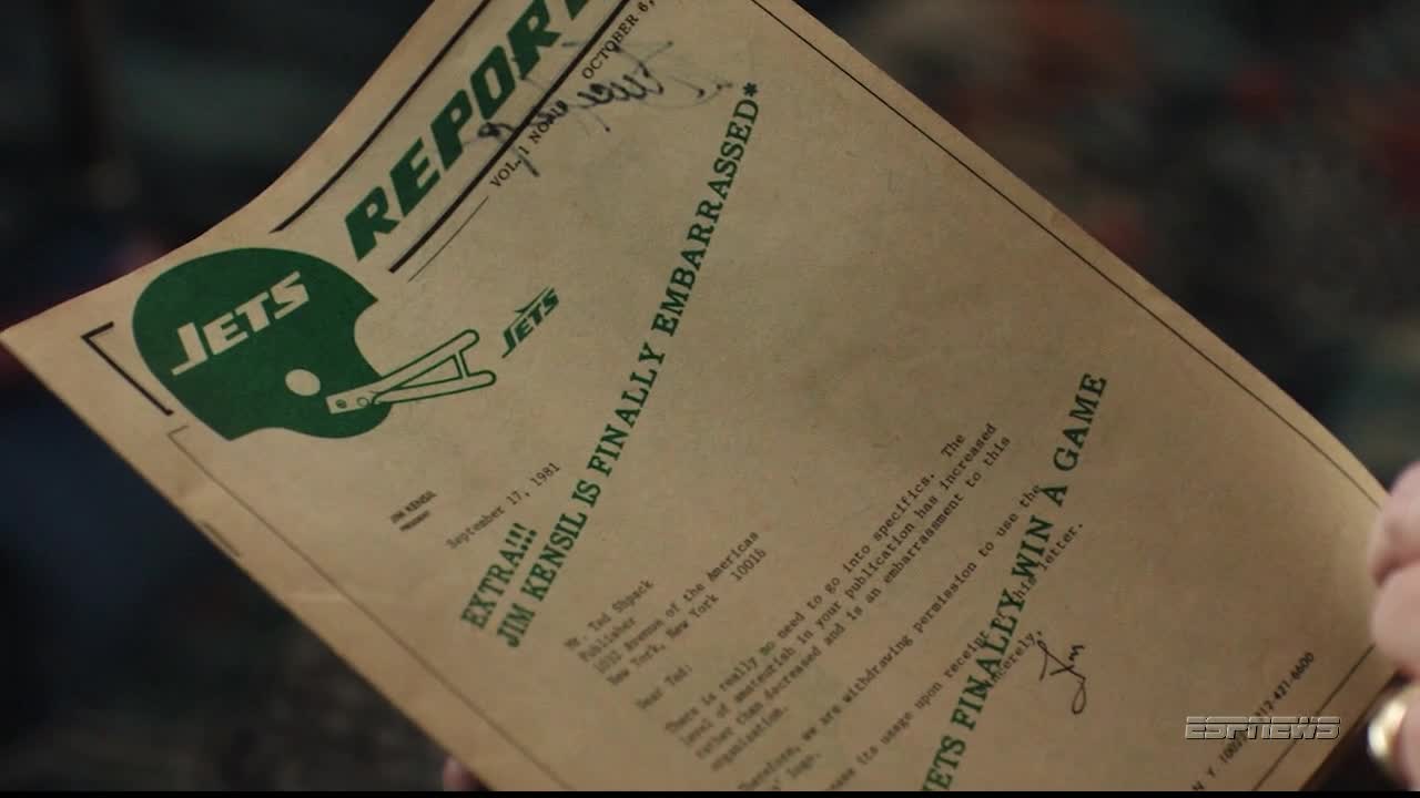 A newspaper, dated September 17, 1981, with a Jets logo and the headline "Jim Kensil is Finally Embarrassed" is held in someone's hands. The ESPNews logo is visible in the corner.
