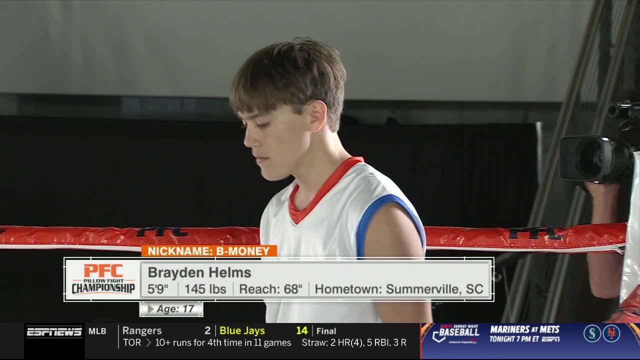 Brayden Helms, nicknamed "B-Money," stands in a ring, looking down. The ESPNews graphic provides his stats from the Pillow Fight Championship.
