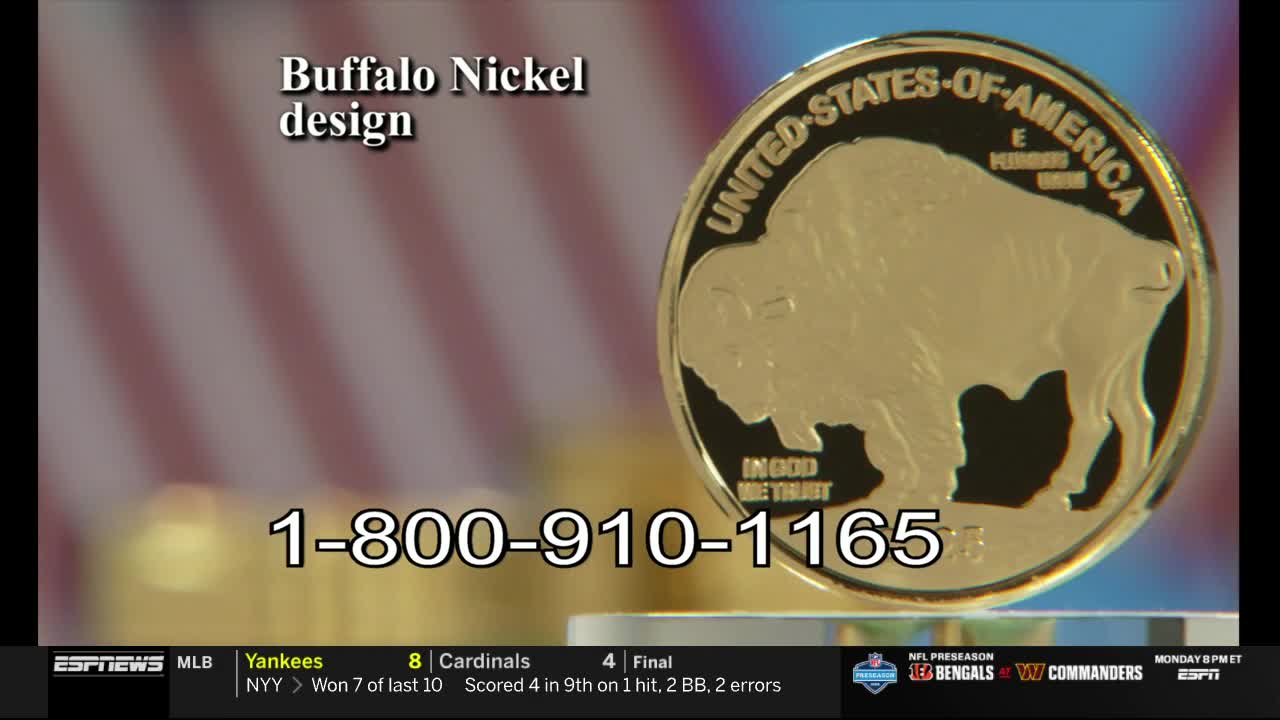 A gold coin, featuring a buffalo design, is displayed prominently against a blurred background. The ESPNews graphic includes a phone number for ordering the coin, while a baseball game score flashes at the bottom.
