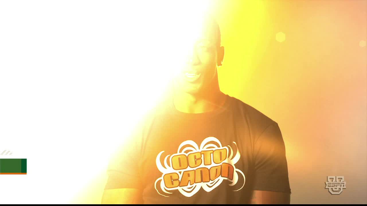 A man in a black t-shirt with "Octo Cannon" on it is illuminated by a bright light, his face partially obscured. The ESPNU logo is visible in the corner.
