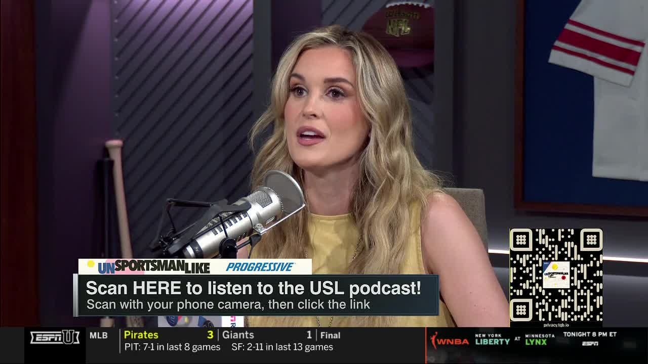 A woman with blonde hair speaks into a microphone, her face illuminated by studio lights. A graphic at the bottom promotes a USL podcast on ESPNU.
