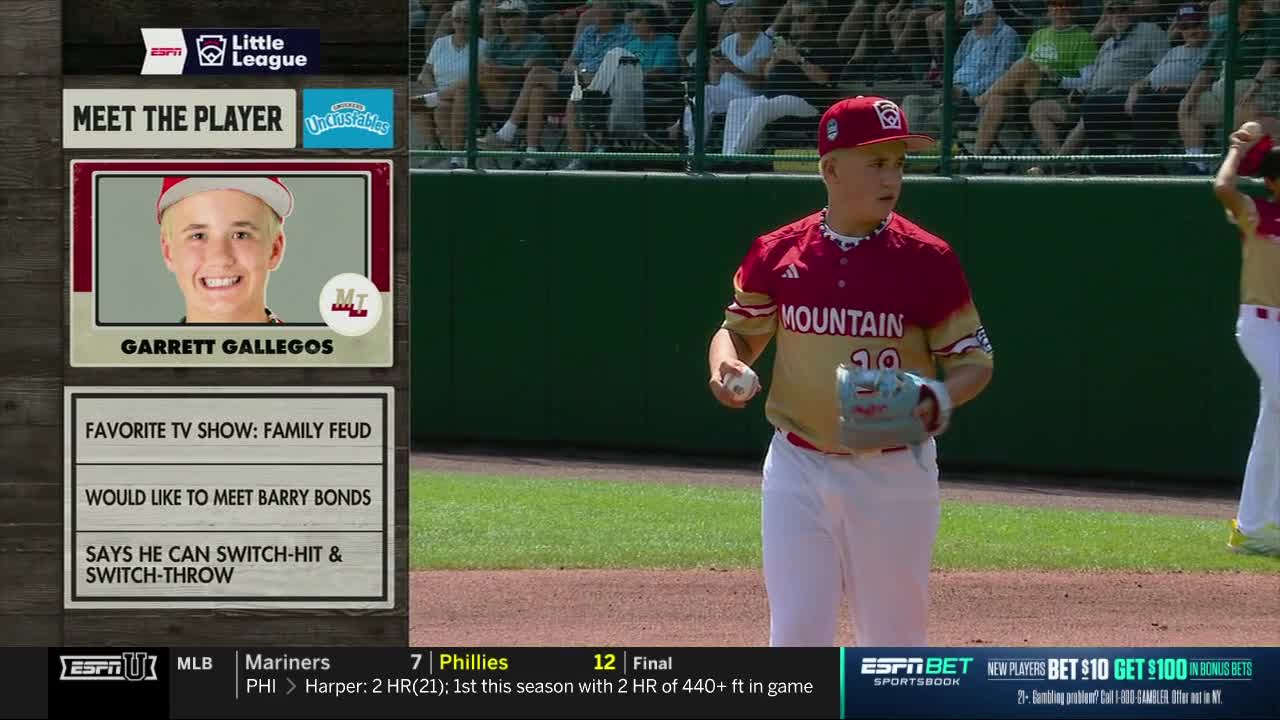 Garrett Gallegos, wearing a Mountain jersey, is holding a baseball and looking toward the field. ESPNU is showing a graphic with his picture and some fun facts.
