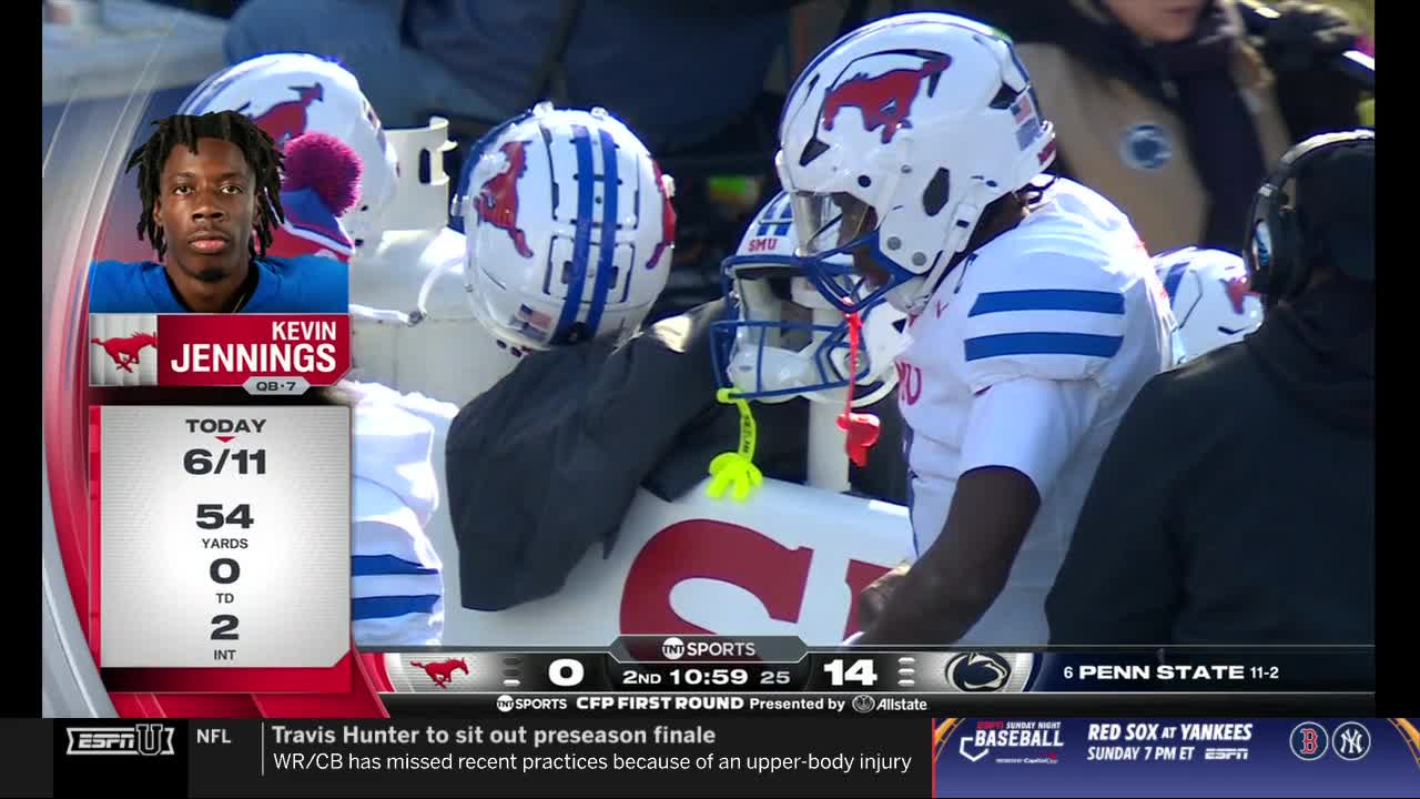 A football player in a white helmet with a red mustang logo stands near the bench. The score is displayed on ESPNU, with Penn State leading SMU.
