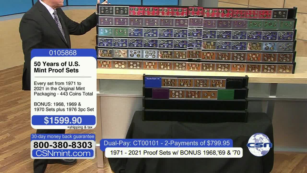 On a Fox Business Network set, a man in a suit gestures toward a display of coin sets arranged in a grid. The on-screen graphic touts "50 Years of U.S. Mint Proof Sets" for sale.
