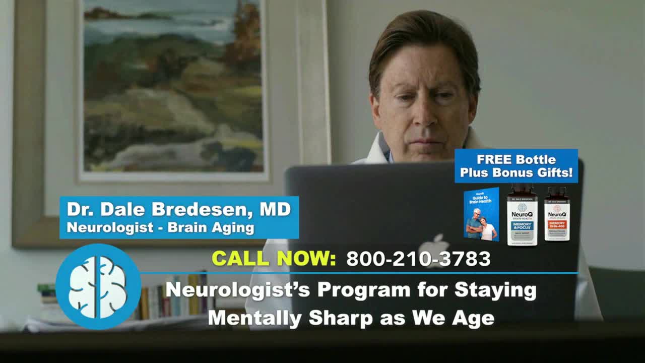 A man in a white coat is working on a laptop, with a framed landscape painting behind him. On the Fox Business Network, a commercial promotes a neurologist's program for brain health.
