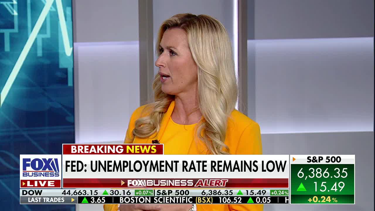 On Fox Business Network, a woman in a bright yellow blazer speaks, her gaze directed slightly off-camera. Below her, the screen displays a "Breaking News" headline about the U.S. unemployment rate.
