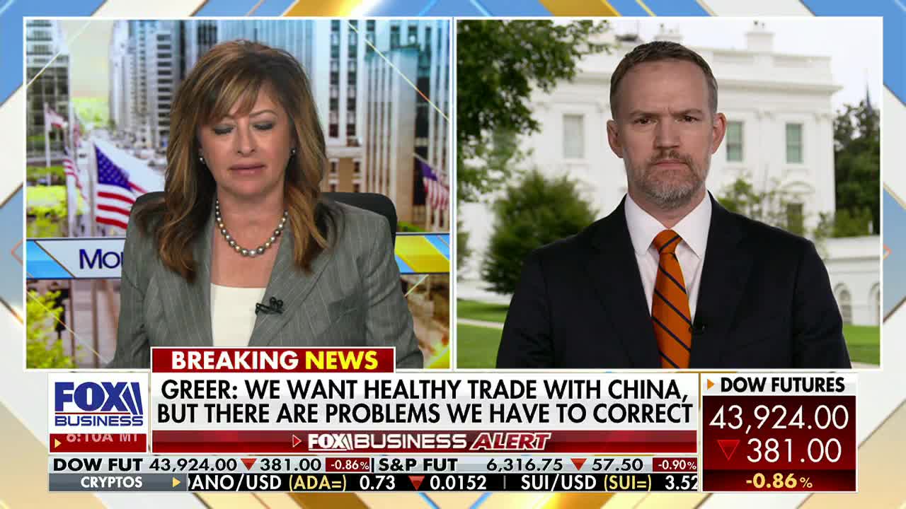 On Fox Business Network, a woman in a gray suit is speaking, while a man in a suit and tie appears on a screen in front of the White House. The lower third of the screen displays market data and a "Breaking News" headline about trade with China.
