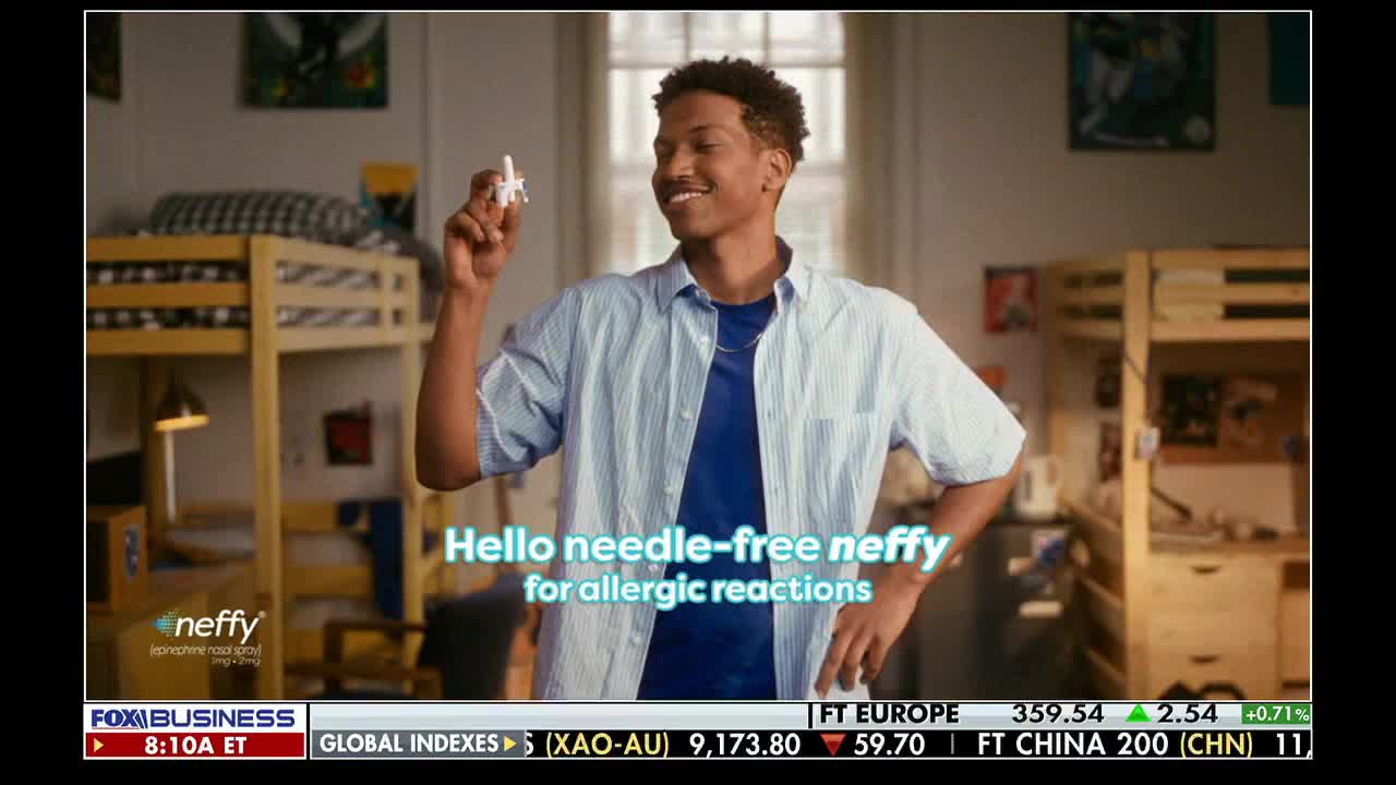 A young man smiles, holding a small white nasal spray. The Fox Business Network logo is visible at the bottom of the screen.
