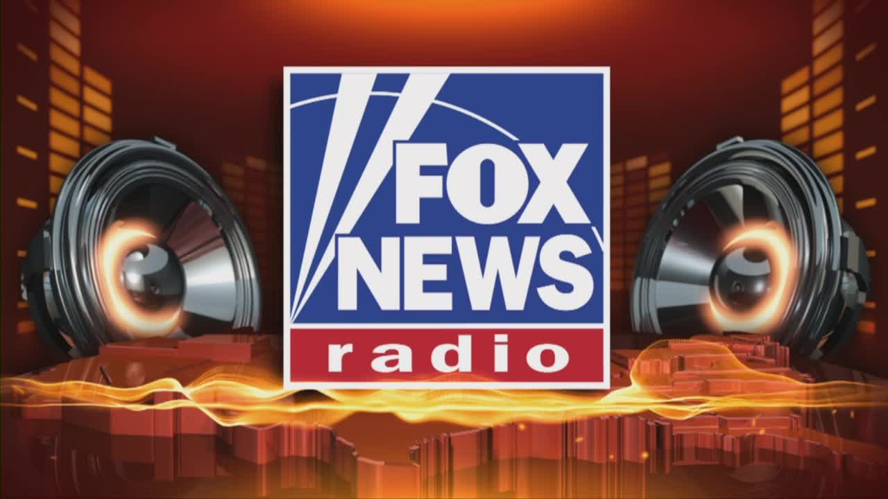 The Fox News Radio logo sits centered against a fiery background, with two large speaker cones flanking it. The speakers pulse with an inner glow, suggesting sound is about to be broadcast across the United States.

