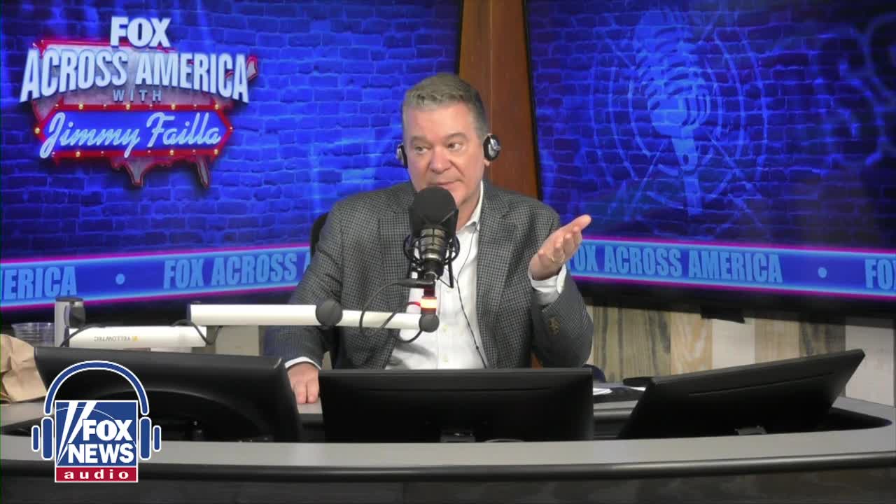 Jimmy Failla, on Fox News Radio, gestures with his right hand while speaking into a microphone. He's seated behind a desk, with the "Fox Across America" logo visible behind him.
