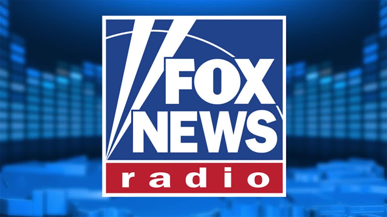 The Fox News Radio logo, a blue square with white text, is centered against a blurred blue background. Below the logo, the word "radio" is displayed in a red rectangle.
