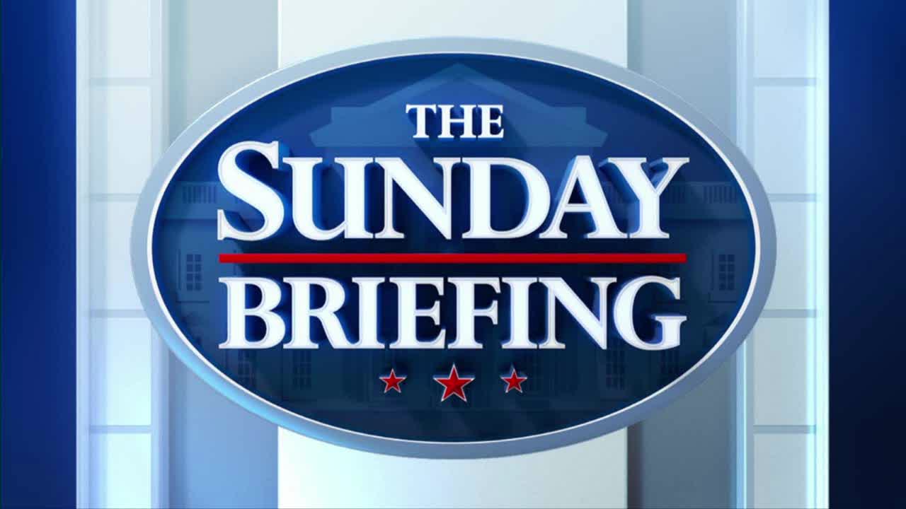 The words "THE SUNDAY BRIEFING" are prominently displayed in white, set against a blue oval. Below, three red stars sit at the bottom of the oval, a familiar sight from Fox News Radio in the United States.
