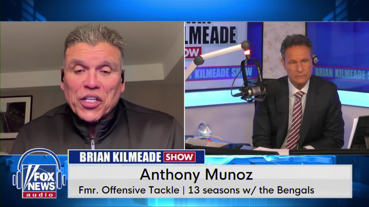 Anthony Munoz, former offensive tackle for the Bengals, speaks animatedly on a video call. Brian Kilmeade sits across from a microphone, listening intently.