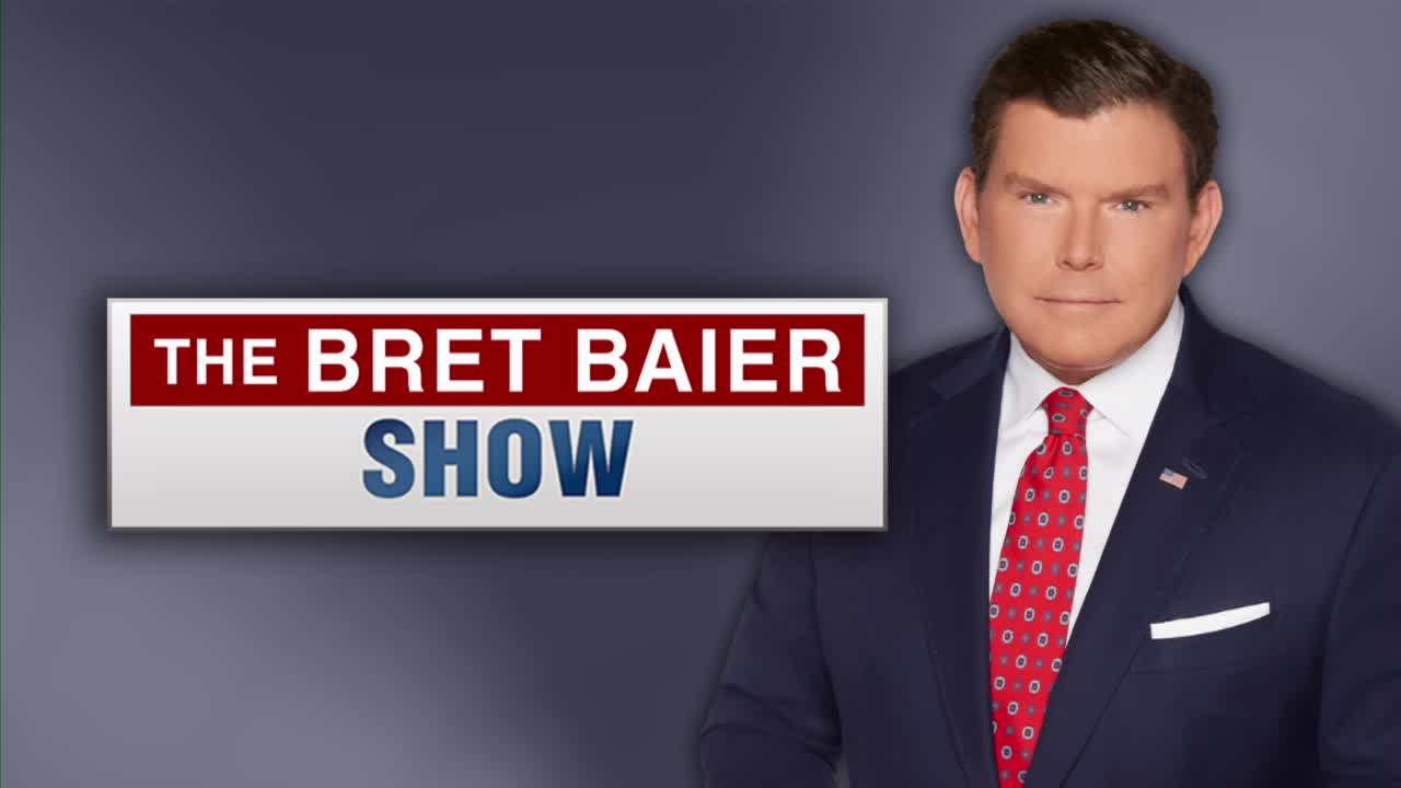A man in a dark suit and a red patterned tie stands to the right of a graphic that reads "THE BRET BAIER SHOW." The graphic's background is a dark blue, with a red bar across the top.