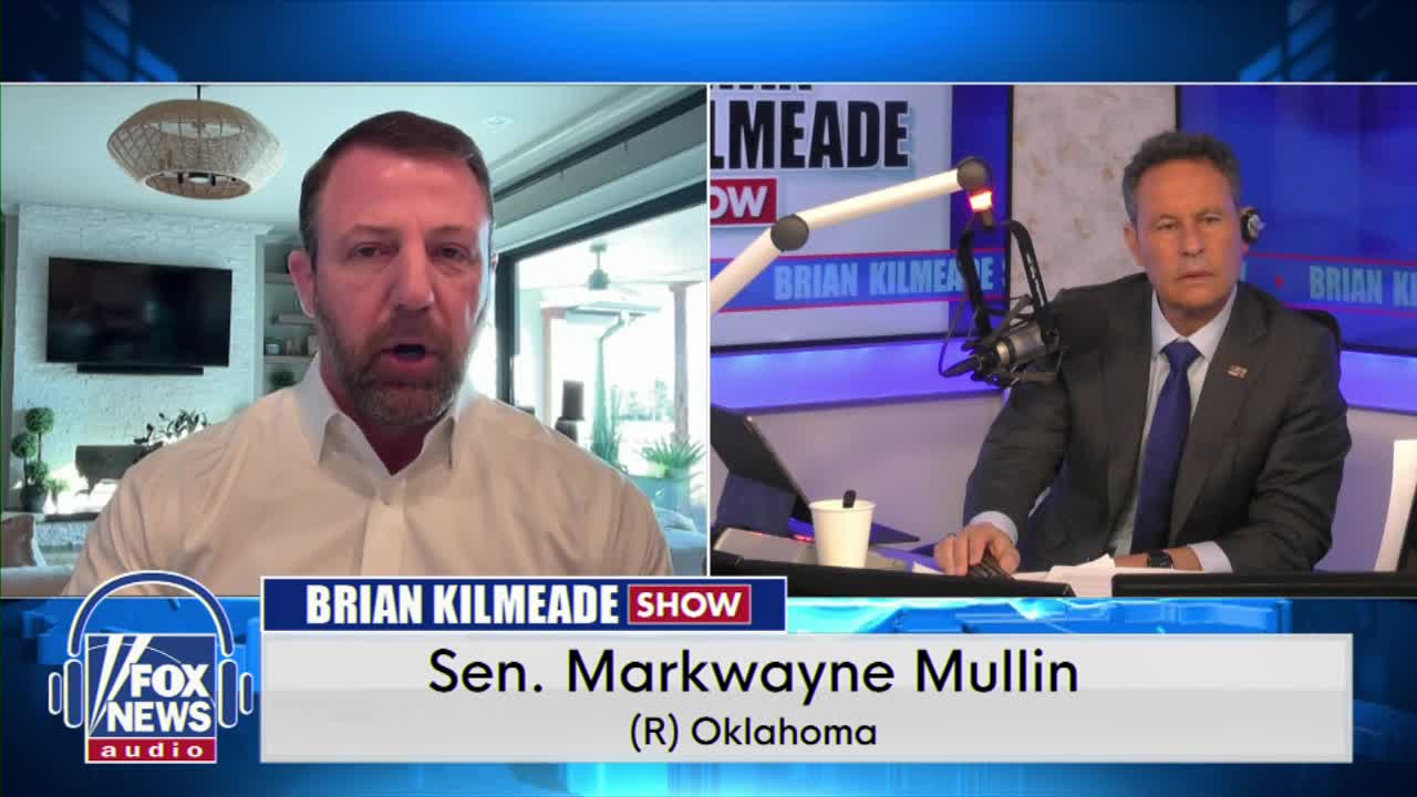 Senator Markwayne Mullin speaks from his home, his face filling the left side of the screen. Brian Kilmeade sits at a radio console on the right, listening intently.
