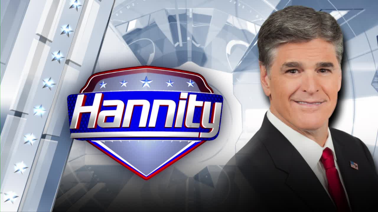 Sean Hannity smiles from the right of the screen, next to the "Hannity" logo, a red, white, and blue emblem. The background features a stylized American flag motif.