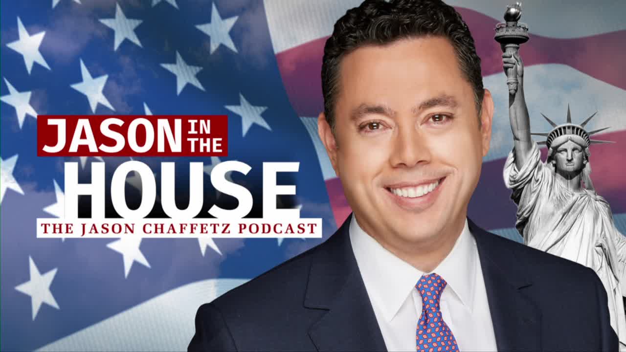 A man in a suit smiles broadly, standing before the American flag and the Statue of Liberty. The words "JASON IN THE HOUSE" and "THE JASON CHAFFETZ PODCAST" are prominently displayed.