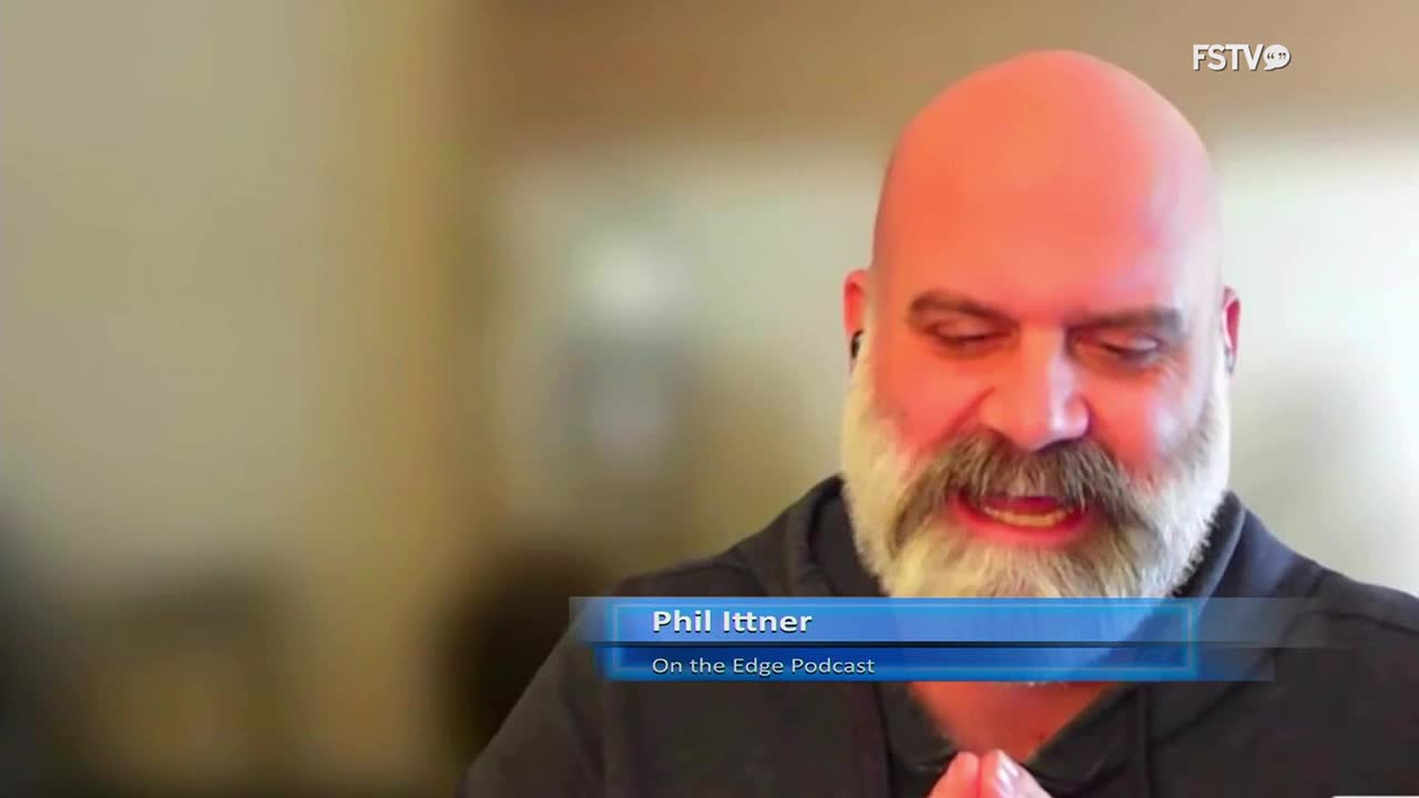 Phil Ittner, from Free Speech TV, is speaking, his hands clasped as he talks. The "On the Edge Podcast" title card is visible at the bottom of the screen.
