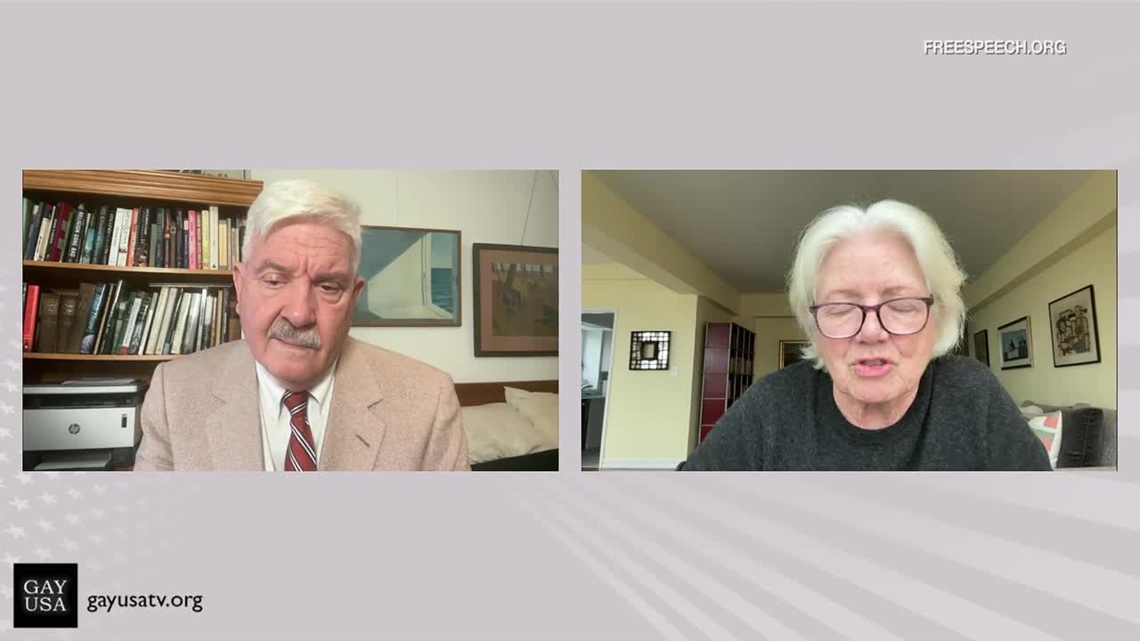 Two people are framed in separate video feeds, likely on a Free Speech TV broadcast. The woman on the right, wearing glasses, is speaking, while the man on the left listens intently.
