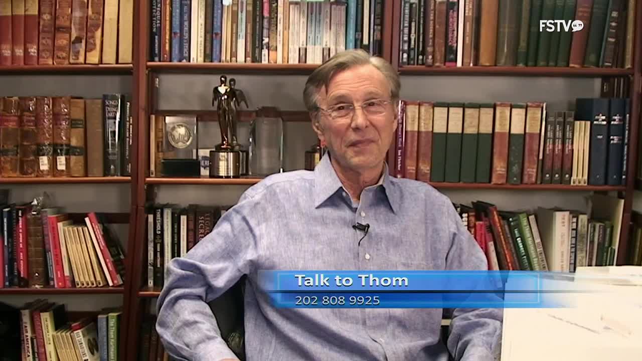 A man in a blue shirt sits in front of bookshelves. A graphic overlay reads "Talk to Thom" and a phone number.