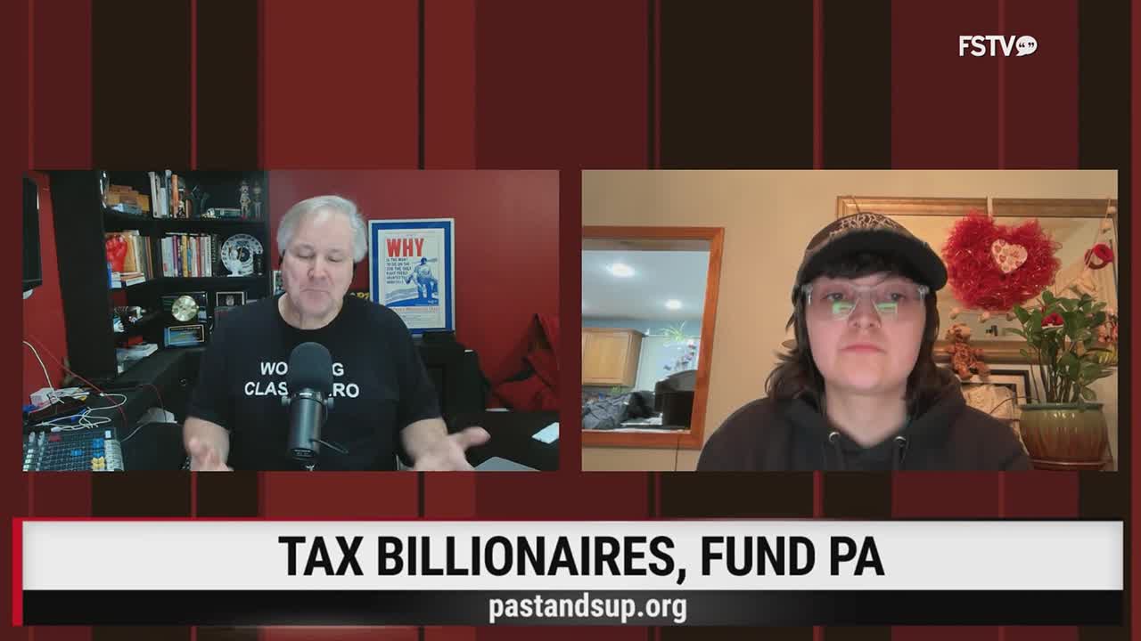 A man in a black t-shirt gestures with his hands while speaking into a microphone. Across from him, a person wearing a black hoodie and a baseball cap looks directly ahead. A banner below them reads "TAX BILLIONAIRES, FUND PA."