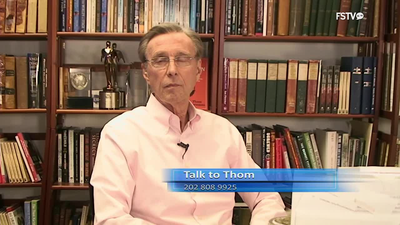 A man in a pink shirt sits before shelves packed with books. A graphic overlay reads "Talk to Thom" with a phone number below it.