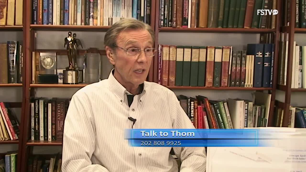 A man with glasses speaks in front of a wall of books. A blue graphic overlay displays "Talk to Thom" and a phone number.