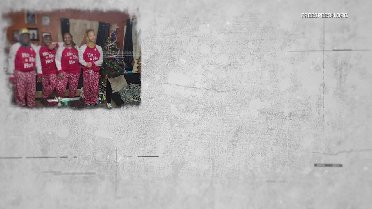 A family stands together in matching "Ho Ho Ho" pajamas. A Christmas tree, decorated with lights, stands behind them.