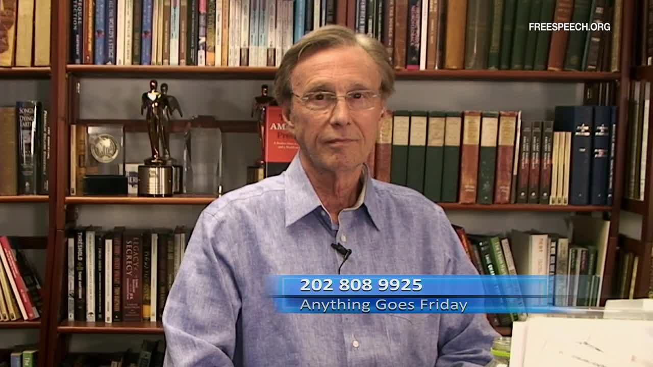 A man in a blue shirt stands before shelves packed with books. A graphic overlay displays a phone number and the words "Anything Goes Friday" from Free Speech TV.