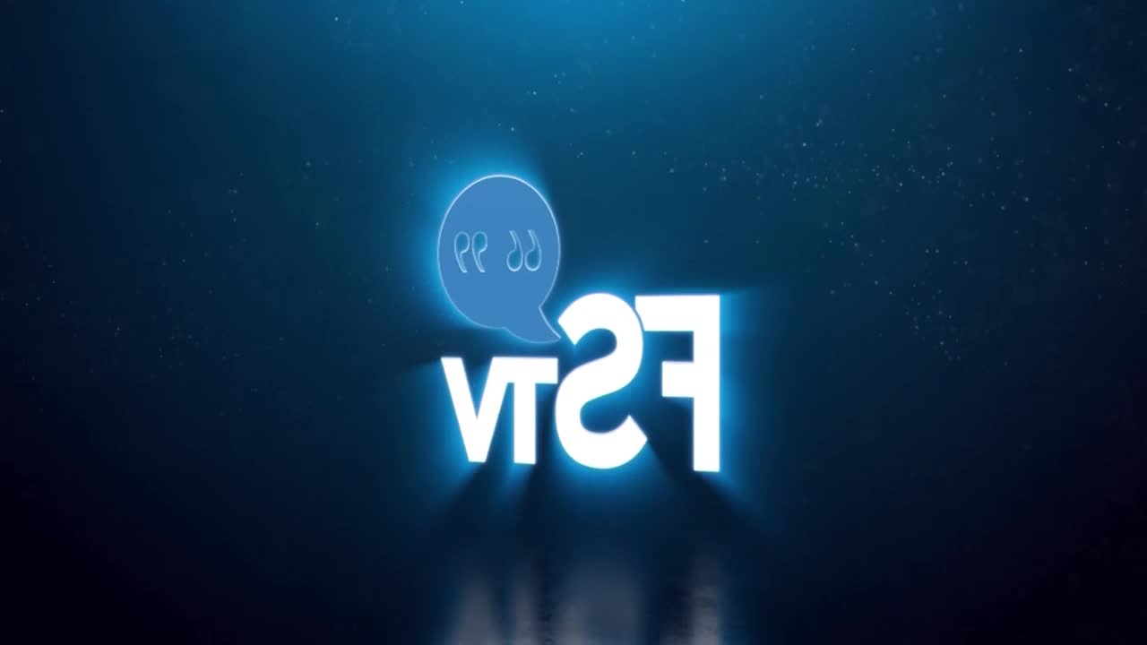 The Free Speech TV logo, FSTV, glows in bright white against a dark blue background. A blue speech bubble with two stylized figures inside hovers above the letters.