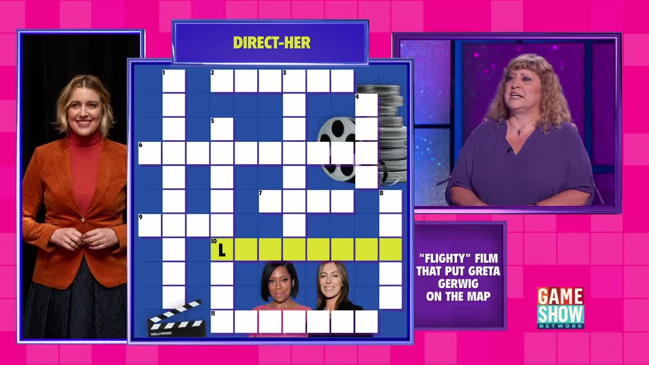 The host, in an orange blazer, stands ready as a contestant on Game Show Network ponders a crossword clue. The clue, "Flighty Film That Put Greta Gerwig on the Map," is displayed next to the contestant.
