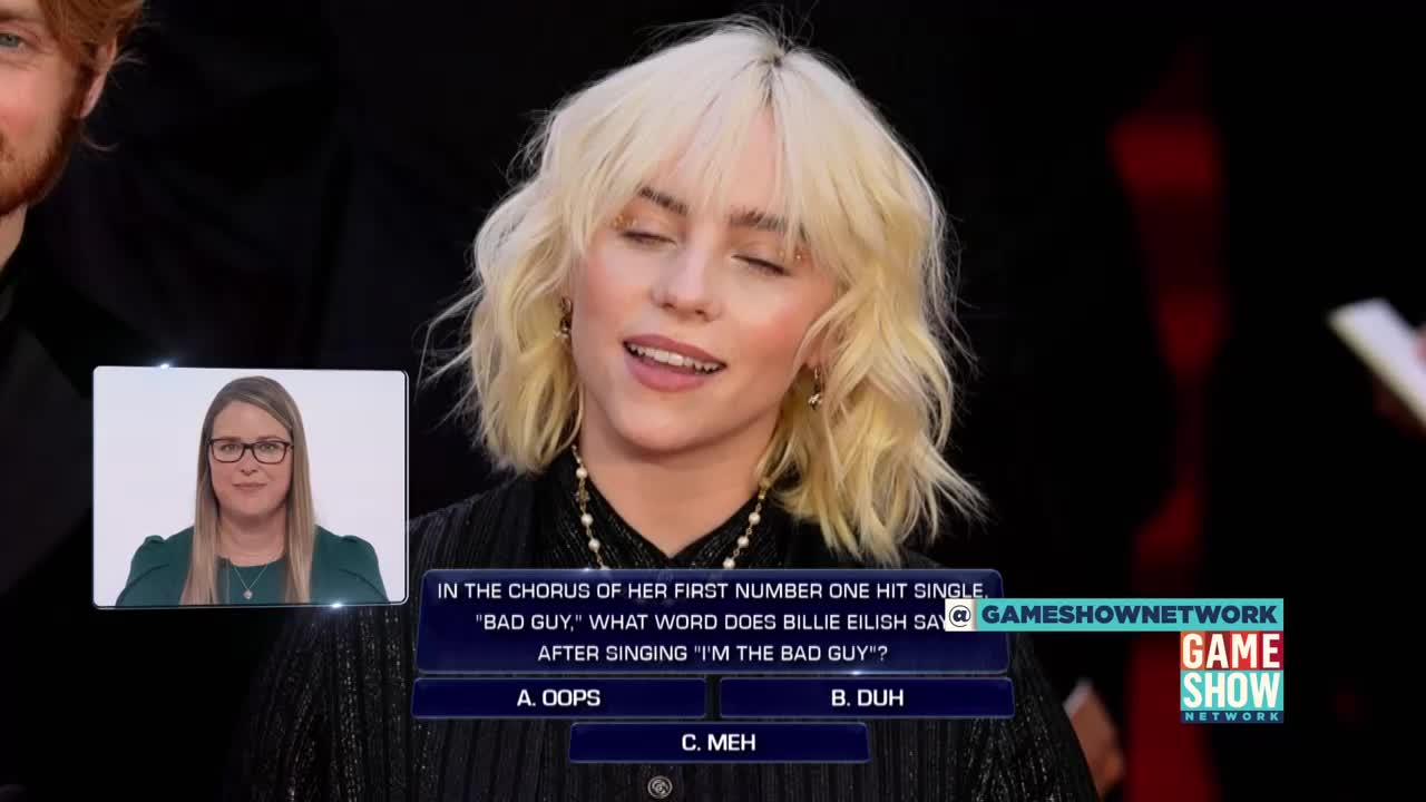 Billie Eilish is on screen, answering a question about her song "Bad Guy." A contestant in a small inset is ready to see if they know the answer on the Game Show Network.
